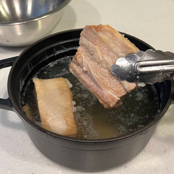 removing the fat and the pork from the broth